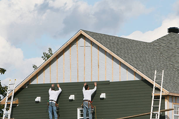Professional Siding Contractor technician working in Lawrence, MA